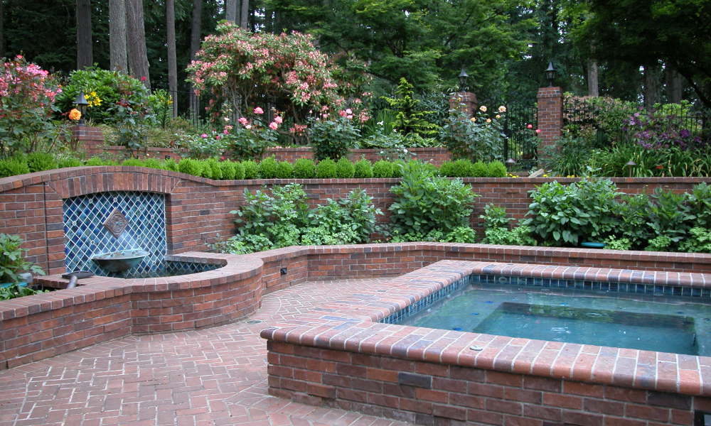 https://www.stangelandlandscape.com/wp-content/uploads/2015/07/in-ground-spa-and-fountain-500x360.jpg